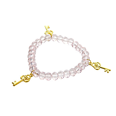 Pulsera Cristal Rosa Con Dije De Tres Llaves